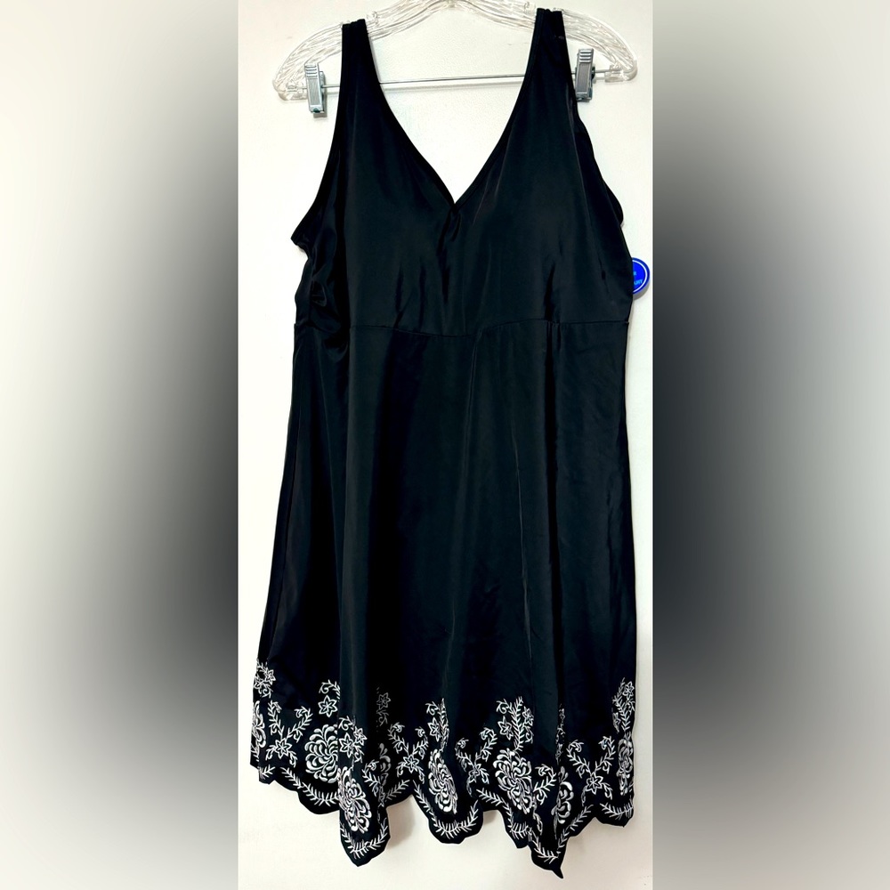 Size 22 black swimsuit with hem appliqué.